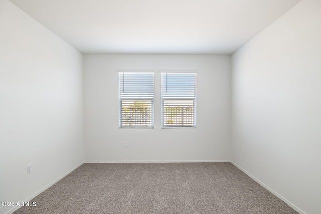 25235 N 183rd Dr, Wittmann, AZ 85361 - carpeted empty room with baseboards