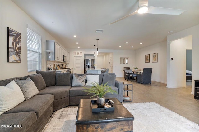 living room with ceiling fan