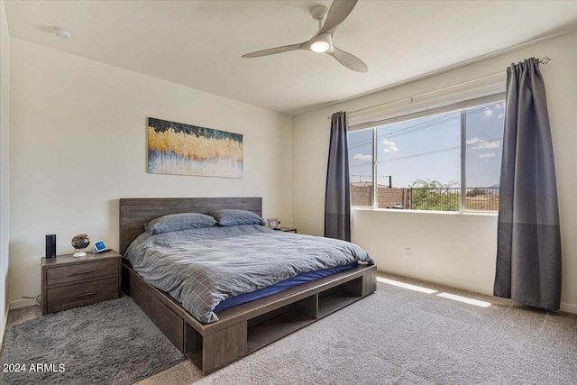 bedroom with ceiling fan and light carpet