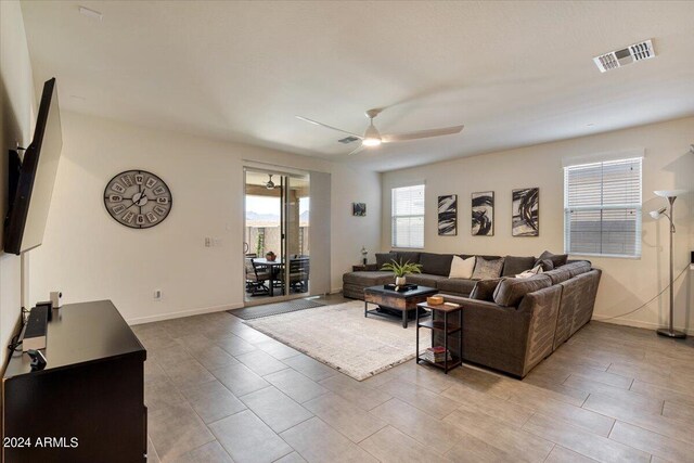 carpeted bedroom featuring ceiling fan and a closet