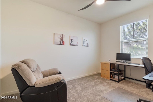 carpeted office space with ceiling fan