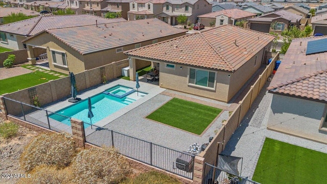 view of pool with an in ground hot tub and a patio area