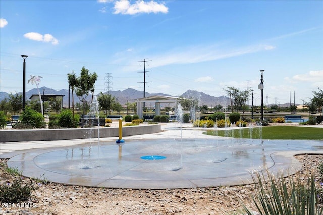 view of swimming pool featuring a mountain view and a gazebo