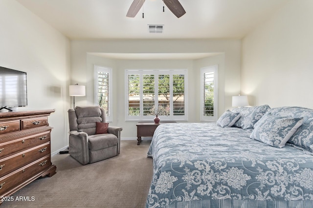 bedroom featuring light colored carpet and ceiling fan