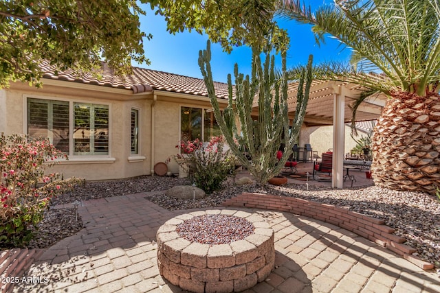 view of patio / terrace featuring a pergola and an outdoor fire pit