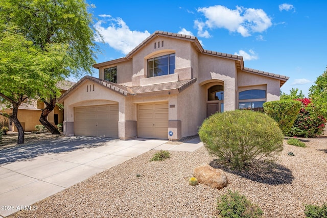 7758 E Nestling Way, Scottsdale, AZ 85255 - mediterranean / spanish house with a tiled roof, stucco siding, driveway, an attached garage, and a garage