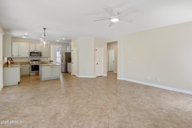 7758 E Nestling Way, Scottsdale, AZ 85255 - unfurnished living room featuring a sink, ceiling fan, baseboards, recessed lighting, and light tile patterned floors