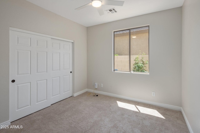 7758 E Nestling Way, Scottsdale, AZ 85255 - unfurnished bedroom with carpet flooring, baseboards, a ceiling fan, and a closet