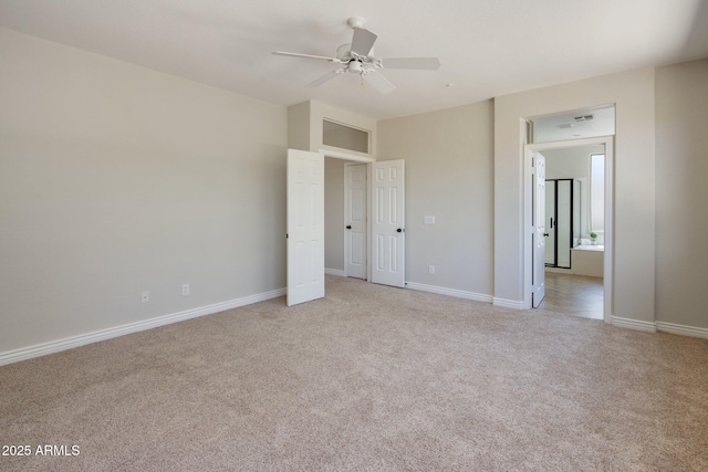 7758 E Nestling Way, Scottsdale, AZ 85255 - unfurnished bedroom featuring light colored carpet, baseboards, and a ceiling fan