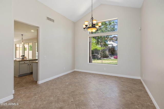 7758 E Nestling Way, Scottsdale, AZ 85255 - unfurnished room featuring a chandelier, baseboards, and high vaulted ceiling
