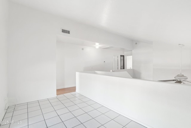 unfurnished room featuring ceiling fan and light tile patterned floors