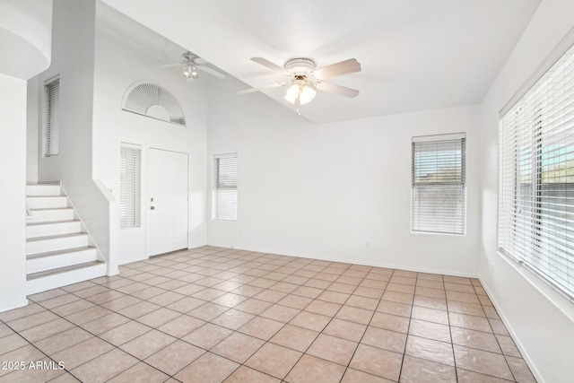 interior space with ceiling fan and lofted ceiling