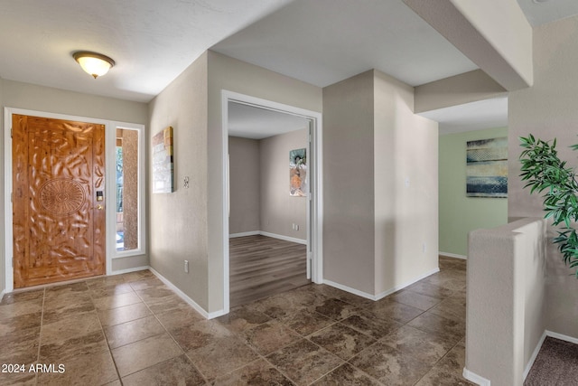 entryway featuring baseboards