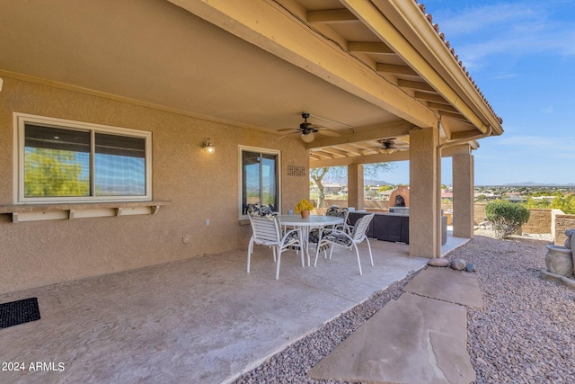 view of patio featuring ceiling fan and outdoor dining area