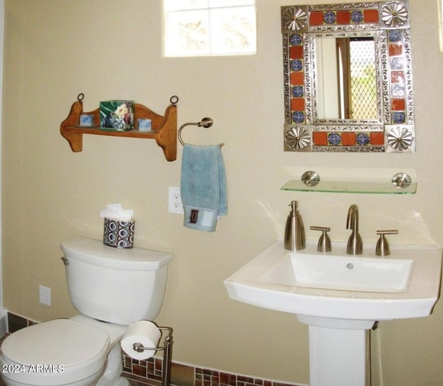 bathroom with a sink and toilet