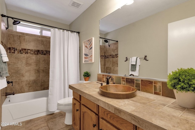 bathroom featuring shower / bath combo, visible vents, vanity, and toilet