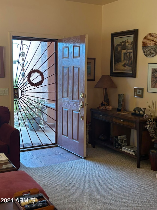 entryway featuring light carpet