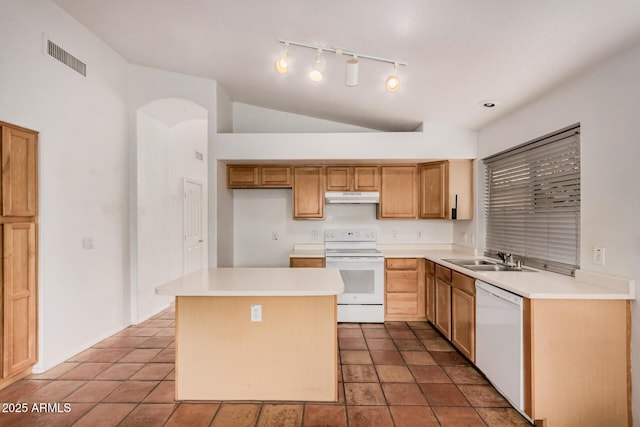 kitchen with visible vents, a sink, under cabinet range hood, a center island, and white appliances