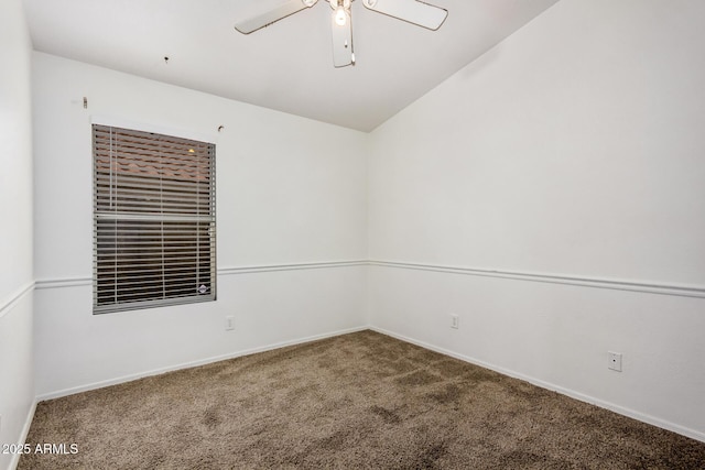 empty room with ceiling fan, baseboards, and carpet