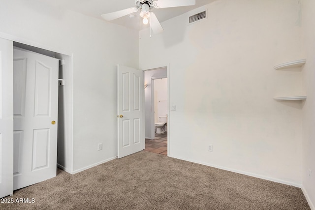 unfurnished bedroom with carpet, visible vents, and baseboards