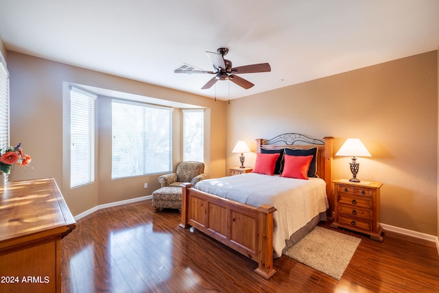 bedroom featuring dark hardwood / wood-style flooring and ceiling fan