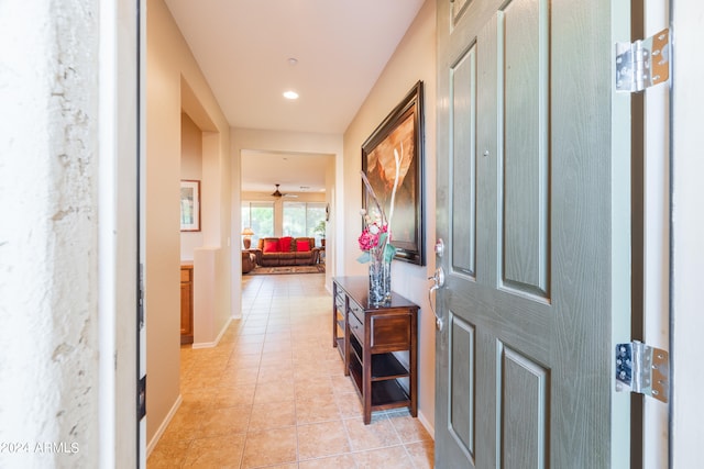 hall featuring light tile floors