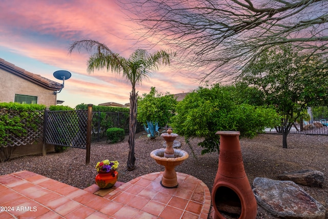 view of patio terrace at dusk