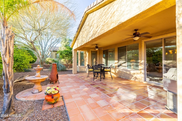 view of patio featuring ceiling fan