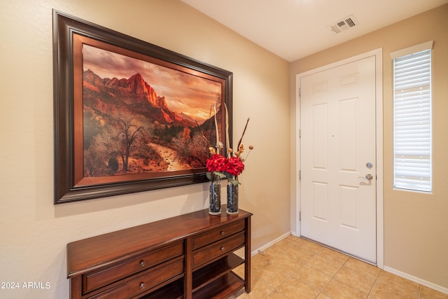 entrance foyer with light tile floors