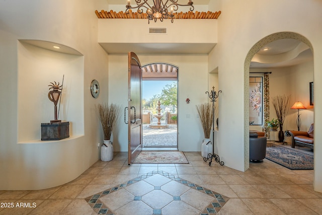 foyer entrance featuring a high ceiling