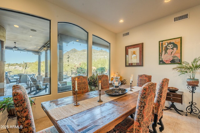 tiled dining area featuring a healthy amount of sunlight