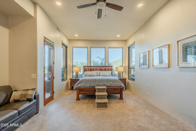 carpeted bedroom featuring ceiling fan