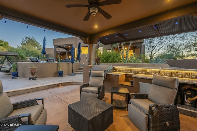 view of patio / terrace with an outdoor living space and ceiling fan