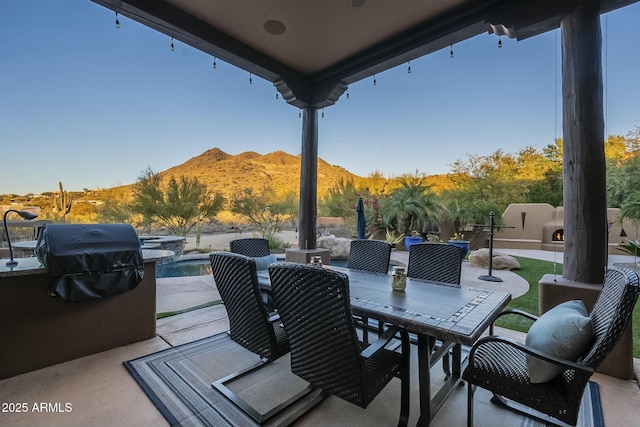 view of patio featuring area for grilling and a mountain view