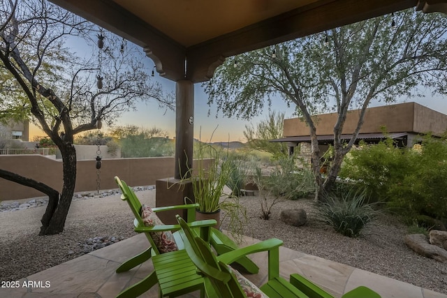 view of patio terrace at dusk