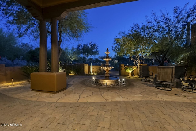 view of patio terrace at dusk