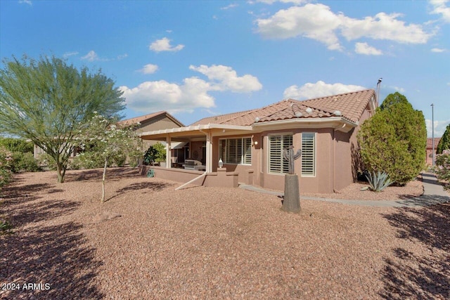 back of house featuring a patio area