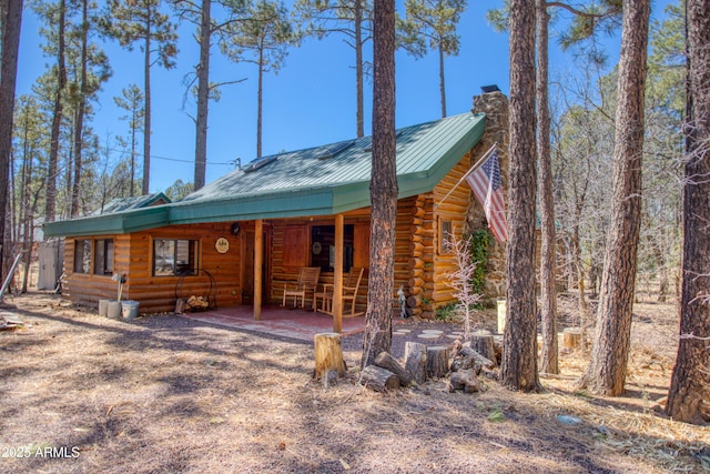 669 W Monarch Cir, Lakeside, AZ 85929 - log cabin featuring a chimney, metal roof, a standing seam roof, and log exterior