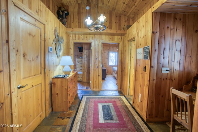 669 W Monarch Cir, Lakeside, AZ 85929 - hallway with a chandelier, wooden walls, wooden ceiling, and lofted ceiling