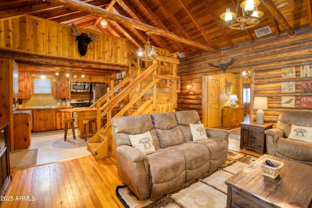669 W Monarch Cir, Lakeside, AZ 85929 - living area with high vaulted ceiling, beamed ceiling, light wood-style flooring, a chandelier, and wooden ceiling