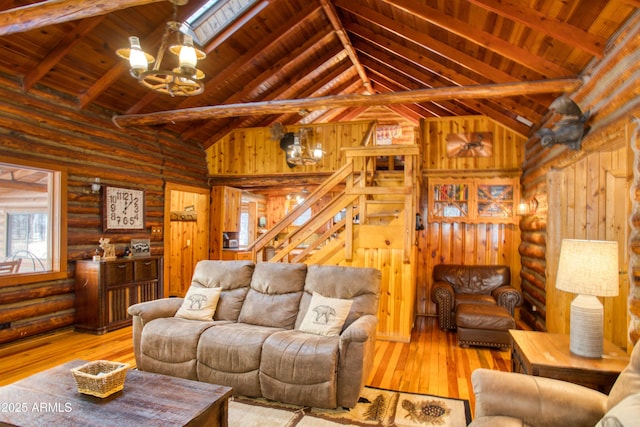669 W Monarch Cir, Lakeside, AZ 85929 - living area featuring a notable chandelier, stairway, beamed ceiling, wood-type flooring, and wooden ceiling