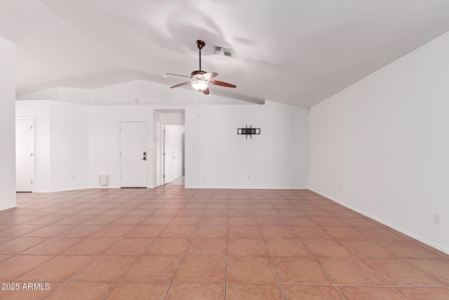 spare room with visible vents, baseboards, lofted ceiling, and ceiling fan