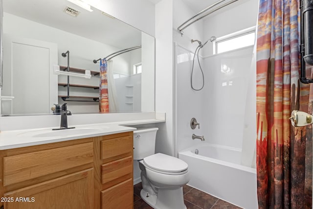 full bathroom with tile patterned floors, visible vents, shower / bath combo with shower curtain, toilet, and vanity