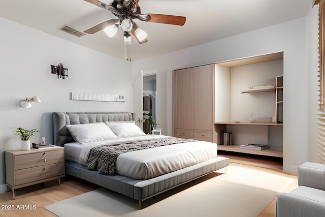 bedroom with a ceiling fan, visible vents, and light wood finished floors