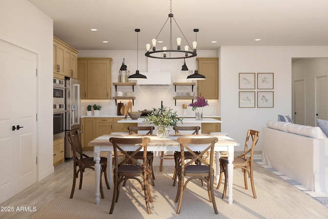 dining area with light wood-type flooring and recessed lighting