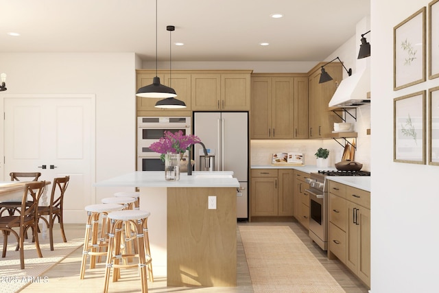 kitchen featuring high quality appliances, decorative light fixtures, a kitchen island with sink, light countertops, and backsplash