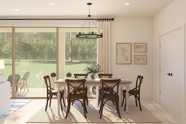 dining room with wood finished floors and recessed lighting