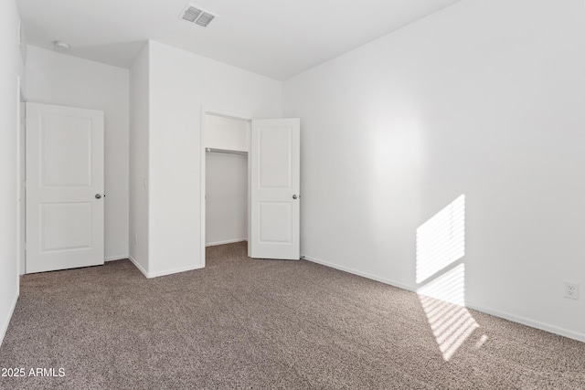 unfurnished bedroom featuring a closet and carpet