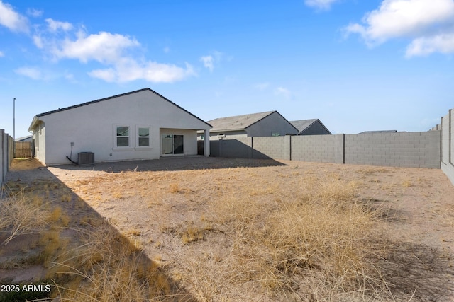 back of house featuring central AC unit