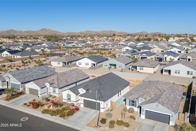 birds eye view of property with a mountain view